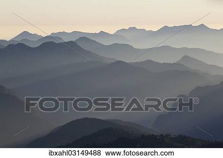 "Backlit mountain ridges seen from Hochiss Mountain in Rofan, Maurach, Tyrol, Austria, Europe" View Large Photo Image Stock Photo - "Backlit mountain ridges seen from Hochiss Mountain in Rofan, Maurach, Tyrol, Austria, Europe". Fotosearch