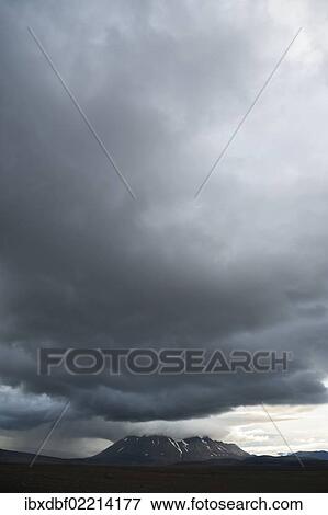 Stock Photo - "Bad weather, view towards snow-covered mountains and Langjoekull Glacier, highland slopes of Kjoelur or Kjalvegur, Highland, Iceland, Europe". Fotosearch
