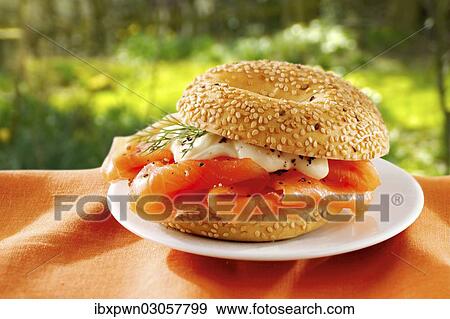 Bagel with cream cheese and smoked salmon View Large Photo Image Stock Photo - Bagel with cream cheese and smoked salmon. Fotosearch