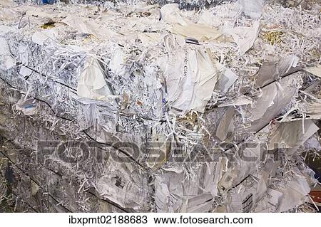 Stock Image - "Bale of recyclable shredded office paper at a sorting centre, Quebec, Canada, North America". Fotosearch