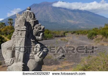"Balinese stone statue, the Gunung Agung volcano at back, Batang, Labasari, Ost-Bali, Bali, Indonesia, Asia" View Large Photo Image Stock Photo - "Balinese stone statue, the Gunung Agung volcano at back, Batang, Labasari, Ost-Bali, Bali, Indonesia, Asia". Fotosearch