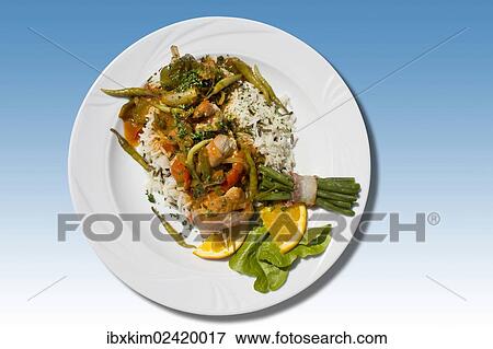 "Balkan skewer, pork with hot peppers, zucchini, bell peppers and beans wrapped in bacon on rice" View Large Photo Image Stock Photo - "Balkan skewer, pork with hot peppers, zucchini, bell peppers and beans wrapped in bacon on rice". Fotosearch