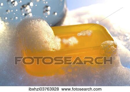 Bar of yellow glycerine soap with foam View Large Photo Image Stock Photo - Bar of yellow glycerine soap with foam. Fotosearch