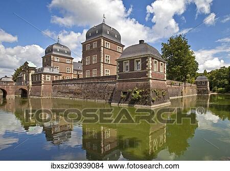 Picture - "Baroque moated castle Ahaus Castle, Technical Academy, Ahaus, Munsterland, North Rhine-Westphalia, Germany, Europe". Fotosearch