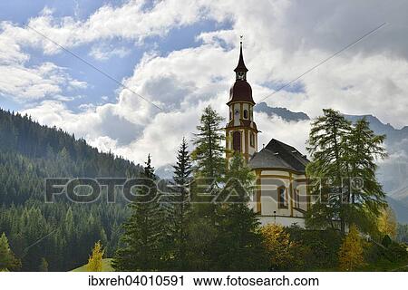 Stock Image - "Baroque parish church of St. Nicholas, Obernberg am Brenner, Tyrol, Austria, Europe". Fotosearch
