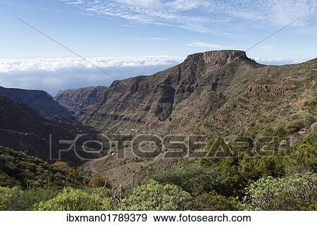 Stock Photo - "Barranco de Erque canyon, Table Mountain Fortaleza, La Gomera island, Canary Islands, Spain, Europe". Fotosearch