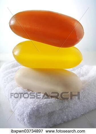 Bars of coloured hand-made soaps piled on a towel View Large Photo Image Stock Photo - Bars of coloured hand-made soaps piled on a towel. Fotosearch