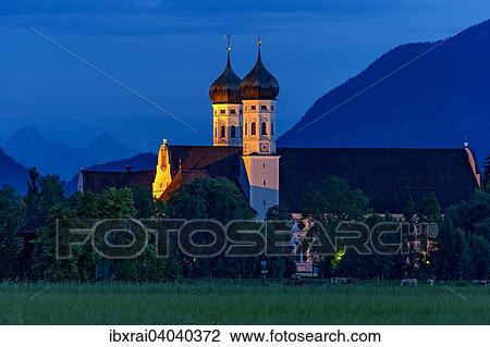 "Basilica of St Benedict, Benedictine monastery Benediktbeuern, rear right Herzogstand of the Alps, in the back Arnspitze Group in the Wetterstein range of the Alps, Benediktbeuern, Upper Bavaria, Bavaria, Germany, Europe" View Large Photo Image Stock Image - "Basilica of St Benedict, Benedictine monastery Benediktbeuern, rear right Herzogstand of the Alps, in the back Arnspitze Group in the Wetterstein range of the Alps, Benediktbeuern, Upper Bavaria, Bavaria, Germany, Europe". Fotosearch