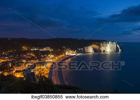 "Bay with a village and chalk cliffs, illuminated in the evening, Etretat, Normandy, France, Europe" View Large Photo Image Stock Photography - "Bay with a village and chalk cliffs, illuminated in the evening, Etretat, Normandy, France, Europe". Fotosearch