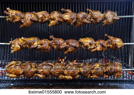 Stock Image - "BBQ chicken, wood grilled". Fotosearch