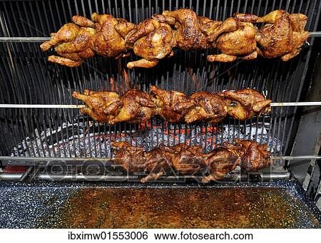 "BBQ grilled chicken, chicken on rotating skewers" View Large Photo Image Stock Photograph - "BBQ grilled chicken, chicken on rotating skewers". Fotosearch