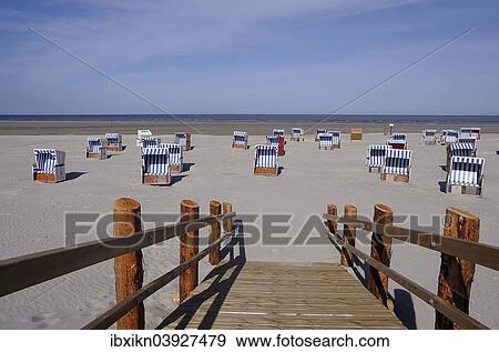 Stock Photo - "Beach chairs, building on stilts, Sankt Peter-Ording, Eiderstedt, North Frisia, Schleswig-Holstein, Germany, Europe". Fotosearch