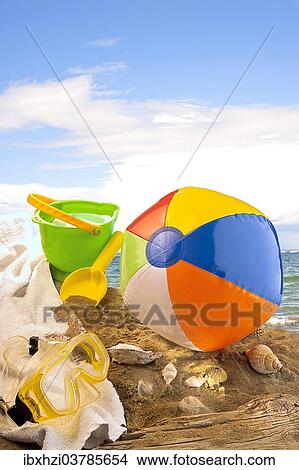 Beach toys on a sandy beach View Large Photo Image Picture - Beach toys on a sandy beach. Fotosearch