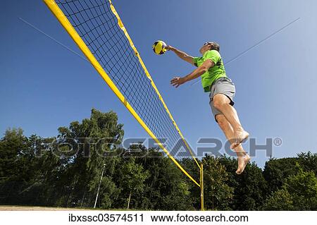 Stock Image - "Beach volleyball player, 44 years, Schorndorf, Baden-Wurttemberg, Germany, Europe". Fotosearch