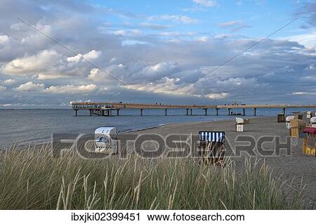 Stock Image - "Beach with the pier, Erlebnis-Seebruecke, Heiligenhafen, Baltic Sea, Schleswig-Holstein, Germany, Europe". Fotosearch