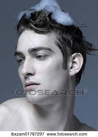 Beauty portrait of a young man washing his hair View Large Photo Image Stock Photo - Beauty portrait of a young man washing his hair. Fotosearch