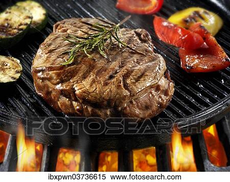 Beef fillet steaks and roast peppers being pan fried on a BBQ View Large Photo Image Stock Photography - Beef fillet steaks and roast peppers being pan fried on a BBQ. Fotosearch