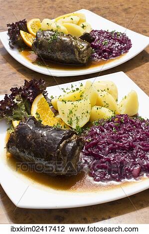 Beef roulade with red cabbage and boiled potatoes View Large Photo Image Stock Image - Beef roulade with red cabbage and boiled potatoes. Fotosearch