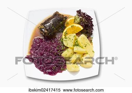 Stock Photography - Beef roulade with red cabbage and boiled potatoes. Fotosearch