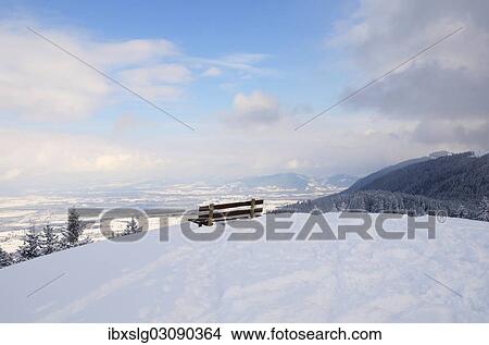 "Bench on a mountain peak, snow-covered Rosenheim Basin and Chiemgau Alps at back, Leitzachtal, bei Elbach, Upper Bavaria, Bavaria, Germany, Europe" View Large Photo Image Picture - "Bench on a mountain peak, snow-covered Rosenheim Basin and Chiemgau Alps at back, Leitzachtal, bei Elbach, Upper Bavaria, Bavaria, Germany, Europe". Fotosearch