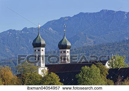 Stock Photo - "Benediktbeuern Abbey and Benediktenwand, Benediktbeuern, Upper Bavaria, Bavaria, Germany, Europe". Fotosearch