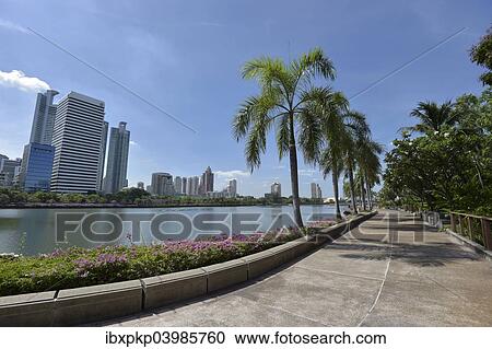 Stock Image - "Benjakiti Park with the skyline of Bangkok, Thailand, Asia". Fotosearch