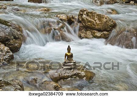 "Bhumispara mudra, Buddha Gautama at the moment of enlightenment, statue in a mountain stream, Oytal Valley, Allgaeu, Bavaria, Germany, Europe, PublicGround, Europe" View Large Photo Image Stock Photo - "Bhumispara mudra, Buddha Gautama at the moment of enlightenment, statue in a mountain stream, Oytal Valley, Allgaeu, Bavaria, Germany, Europe, PublicGround, Europe". Fotosearch