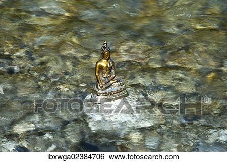 "Bhumispara mudra, Buddha Gautama at the moment of enlightenment, statue in a mountain stream, Oytal Valley, Allgaeu, Bavaria, Germany, Europe, PublicGround, Europe" View Large Photo Image Stock Photograph - "Bhumispara mudra, Buddha Gautama at the moment of enlightenment, statue in a mountain stream, Oytal Valley, Allgaeu, Bavaria, Germany, Europe, PublicGround, Europe". Fotosearch