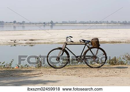 "Bicycle on the banks of the Kosi or Koshi River, Terai region, Nepal, Asia" View Large Photo Image Stock Photo - "Bicycle on the banks of the Kosi or Koshi River, Terai region, Nepal, Asia". Fotosearch
