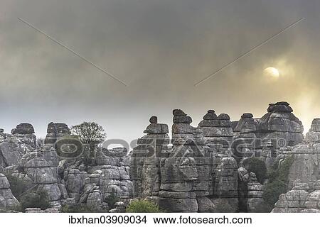 "Bizarre limestone rock formations with the sun and fog, El Torcal Nature Reserve, Antequera, Andalusia, Spain, Europe" View Large Photo Image Picture - "Bizarre limestone rock formations with the sun and fog, El Torcal Nature Reserve, Antequera, Andalusia, Spain, Europe". Fotosearch