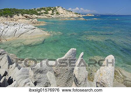 "Bizarre, weathered granite rock boulders in crystal-clear turquoise water at the coast, Capo Ceraso, Sardinia, Italy, Europe" View Large Photo Image Stock Photograph - "Bizarre, weathered granite rock boulders in crystal-clear turquoise water at the coast, Capo Ceraso, Sardinia, Italy, Europe". Fotosearch