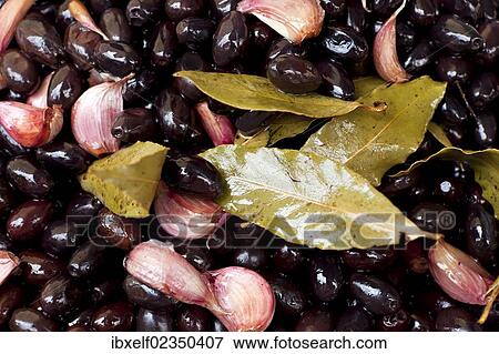 "Black olives with garlic, weekly market, Majorca, Spain, Europe" View Large Photo Image Stock Photo - "Black olives with garlic, weekly market, Majorca, Spain, Europe". Fotosearch