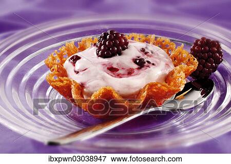 Blackberry mousse in a brandy snap basket View Large Photo Image Stock Photo - Blackberry mousse in a brandy snap basket. Fotosearch
