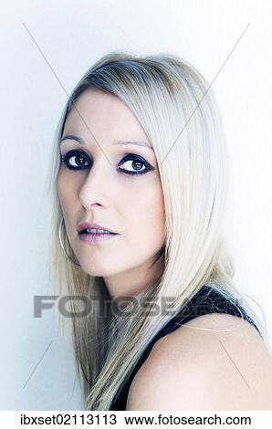 Stock Image - "Blonde young woman, beauty portrait". Fotosearch