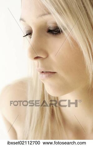 "Blonde young woman, looking down, beauty portrait" View Large Photo Image Stock Image - "Blonde young woman, looking down, beauty portrait". Fotosearch