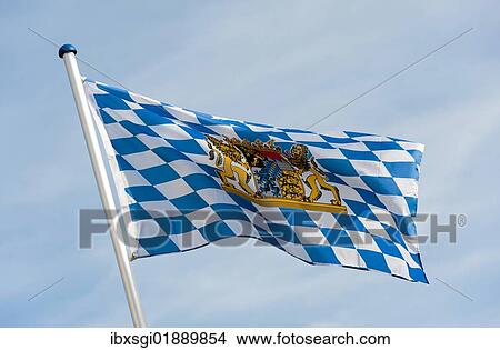 Blue and white flag with the coat of arms of the Free State of Bavaria is blowing in the wind View Large Photo Image Picture - Blue and white flag with the coat of arms of the Free State of Bavaria is blowing in the wind. Fotosearch