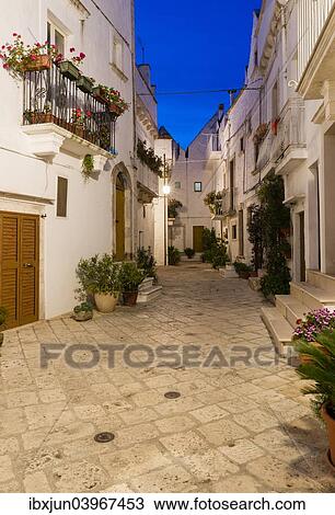 "Blue hour, dusk, alleyway, Locorotondo, Apulia, Italy, Europe" View Large Photo Image Stock Image - "Blue hour, dusk, alleyway, Locorotondo, Apulia, Italy, Europe". Fotosearch