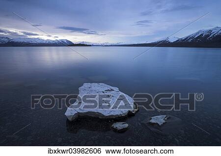 "Blue Hour, dusk, at Lake Tekapo in front of mountain range, Canterbury Region, South Island, New Zealand, Oceania" View Large Photo Image Stock Photograph - "Blue Hour, dusk, at Lake Tekapo in front of mountain range, Canterbury Region, South Island, New Zealand, Oceania". Fotosearch