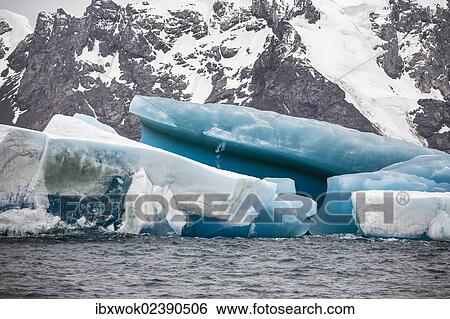 Stock Photograph - "Blue iceberg off Laurie Island, Washington Strait, South Orkneys, Southern Ocean, Antarctica". Fotosearch