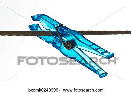Blue peg on a clothesline View Large Photo Image Stock Photo - Blue peg on a clothesline. Fotosearch