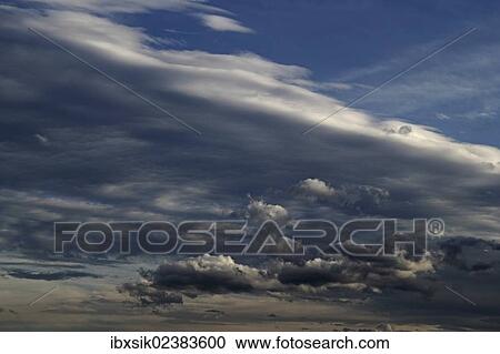 Blue sky with clouds View Large Photo Image Stock Image - Blue sky with clouds. Fotosearch