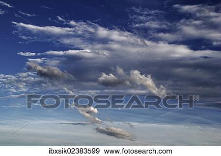 Blue sky with clouds View Large Photo Image Stock Photo - Blue sky with clouds. Fotosearch
