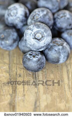 Blueberries on wooden underground View Large Photo Image Stock Image - Blueberries on wooden underground. Fotosearch
