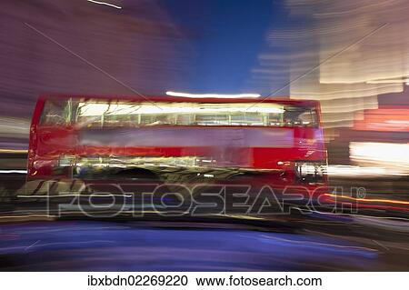 Stock Image - "Blurry red bus, Piccadilly Circus, London, England, United Kingdom, Europe". Fotosearch