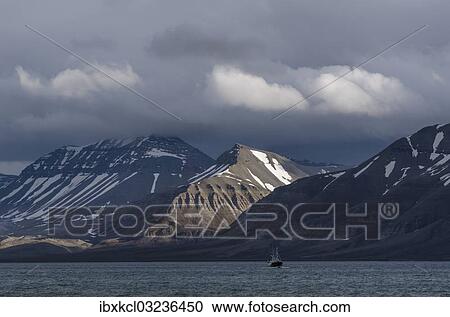 "Boat in Billefjorden in front of mountain scenery in Bonsow Land, Isfjorden, Spitsbergen Island, Svalbard Archipelago, Svalbard and Jan Mayen, Norway, Europe" View Large Photo Image Stock Image - "Boat in Billefjorden in front of mountain scenery in Bonsow Land, Isfjorden, Spitsbergen Island, Svalbard Archipelago, Svalbard and Jan Mayen, Norway, Europe". Fotosearch