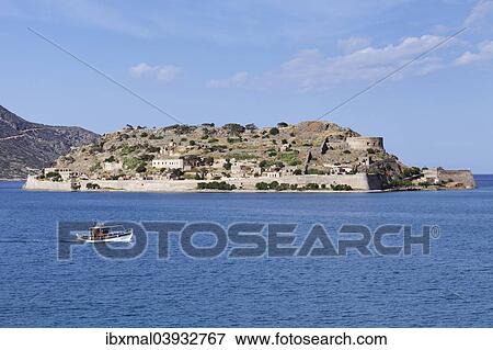 Stock Photo - "Boat off the Spinalonga peninsula, Kalidon, Elounda Gulf, Crete, Greece, Europe". Fotosearch