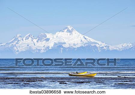 "Boat on the beach of Kenai, Mt Redoubt volcano at the back, Kenai, Alaska, United States, North America" View Large Photo Image Stock Photo - "Boat on the beach of Kenai, Mt Redoubt volcano at the back, Kenai, Alaska, United States, North America". Fotosearch