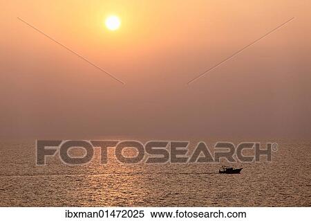 Stock Photography - "Boat on the sea, sunset, Kovalam, Kerala, southern India, India, Asia". Fotosearch