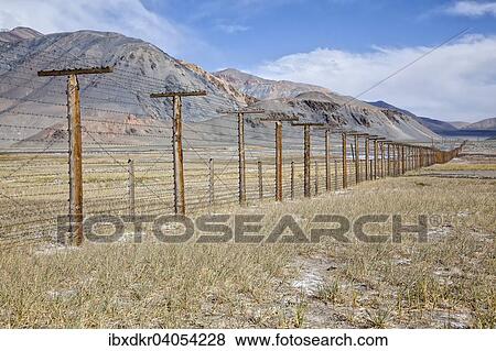 Stock Photo - "Border fence between Tajikistan and China, Pamir Highway, M41, Province of Gorno-Badakhshan, Tajikistan, Asia". Fotosearch