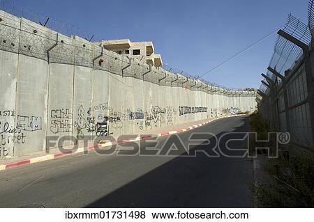 "Border fortification between Israel and the Palestinian territories in the West Bank near Ramallah, Middle East" View Large Photo Image Stock Photo - "Border fortification between Israel and the Palestinian territories in the West Bank near Ramallah, Middle East". Fotosearch